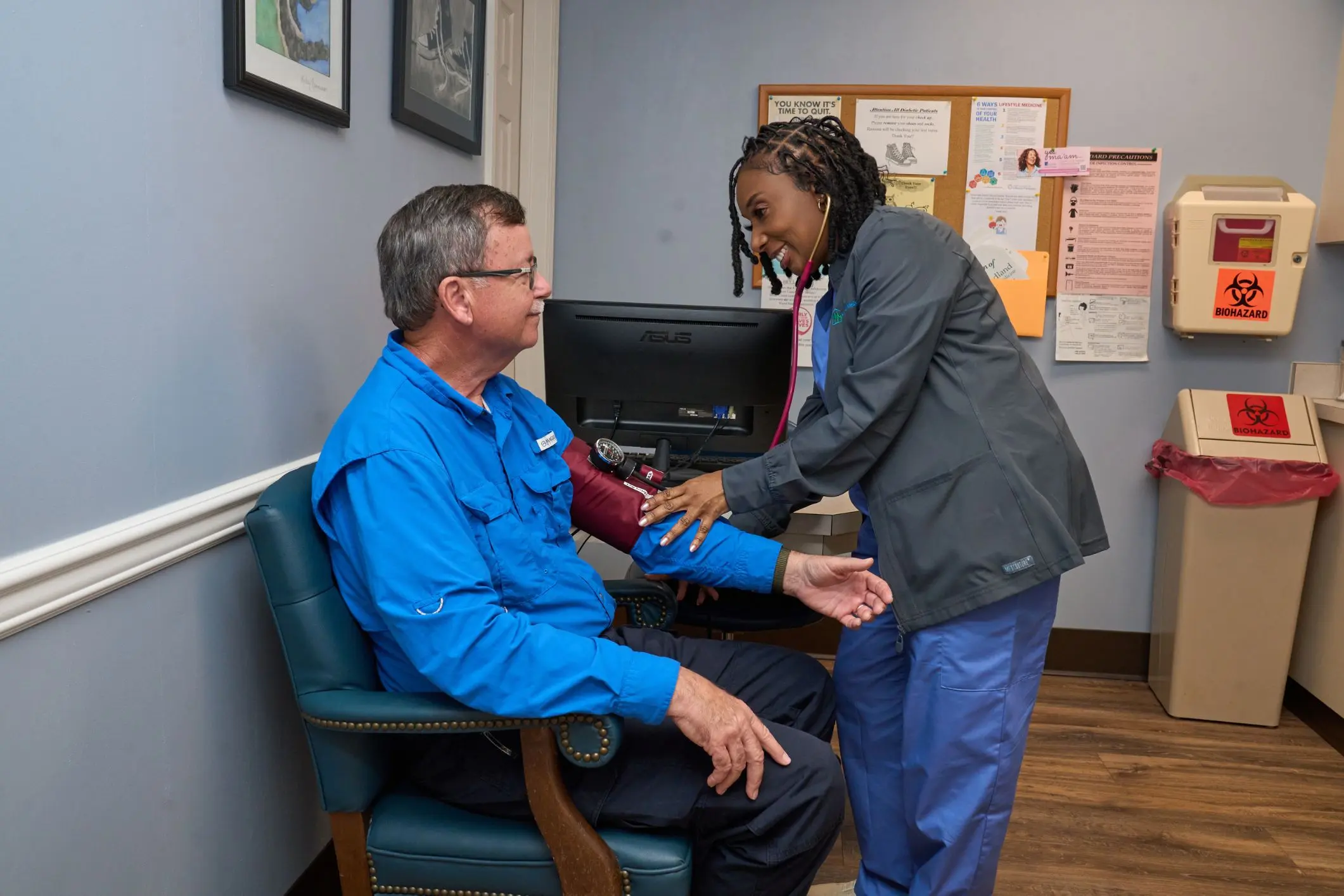 Medical assistant takes a patient's blood pressure